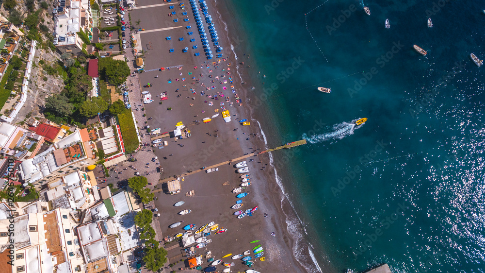 top down aerial view of the touristic city, the mountains and the beach, hotels and restaurants, buildings, business tours, sea holidays, luxury apartments Positano, Amalfi, Italy