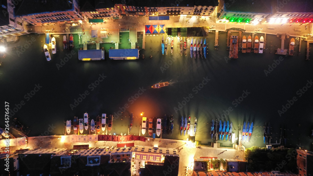 Aerial night shot of beautiful illuminated Grand Canal with colourful Gondolas and boats, Venice, Italy