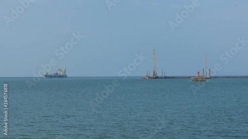 Pier dradger anchored at Port of Liepaja, wide shot photo