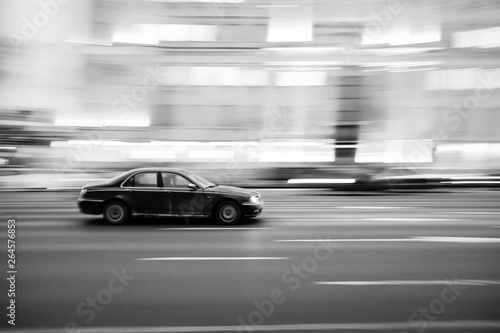 Car at high speed with a blurred image on the background of the city in the dark © Nekrasov