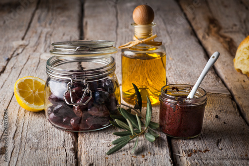 olives, olive oil and olive paste photo