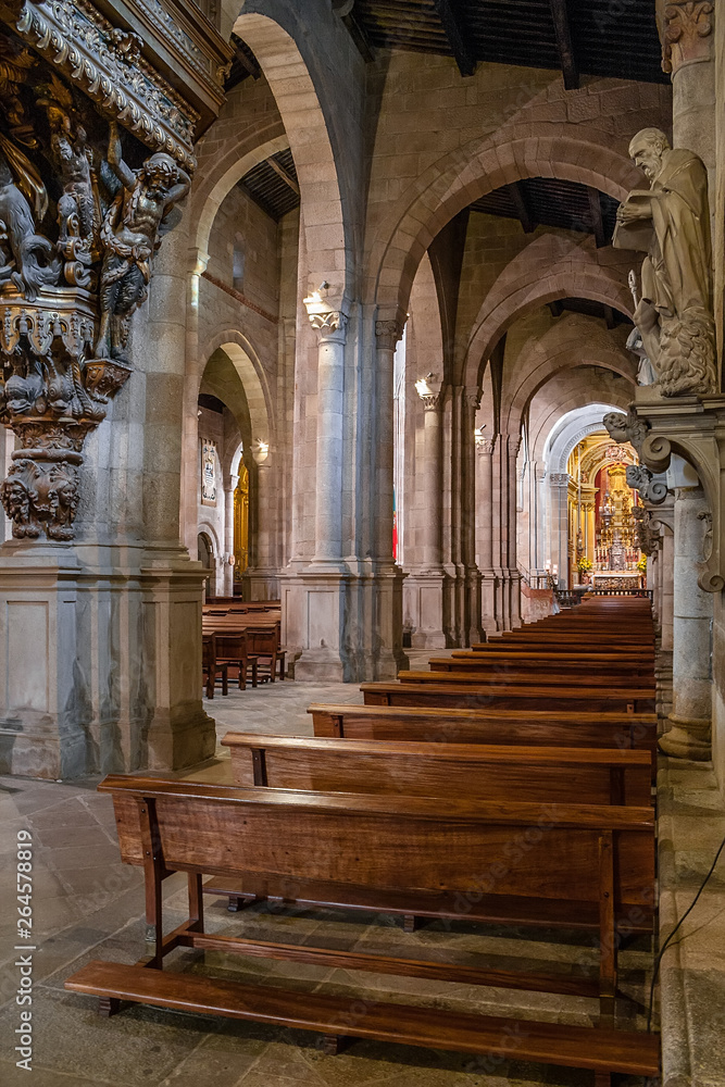Braga, Portugal - December 28, 2017: Se de Braga Cathedral interior. Aisle and chapel. Oldest Cathedral in Portugal. 11th century Romanesque with Gothic and Baroque adding