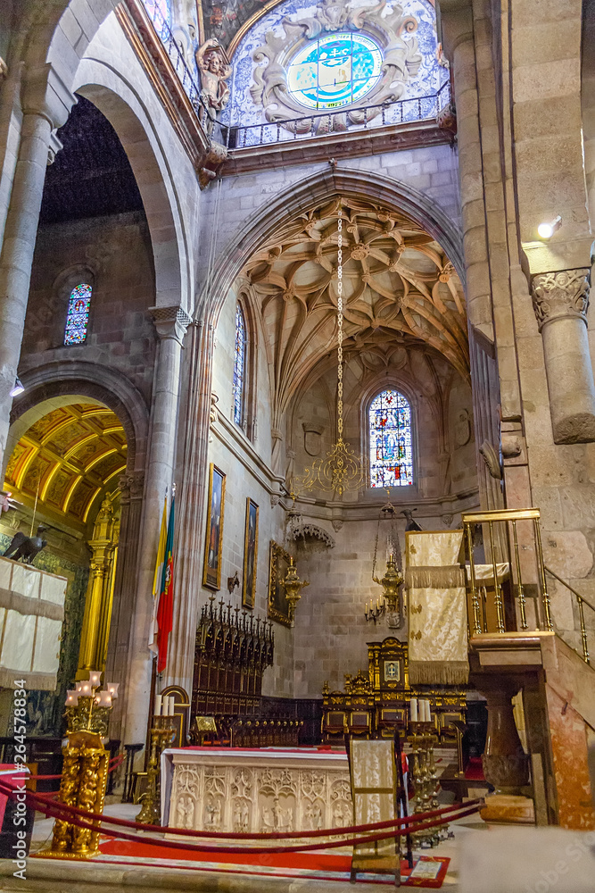 Braga, Portugal - December 28, 2017: Se de Braga Cathedral. Manuelino Gothic main chapel. Ornate stone carved altar. Oldest Cathedral in Portugal. 11th century Romanesque, with Gothic Baroque