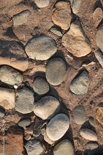 round stones on a sandy beach