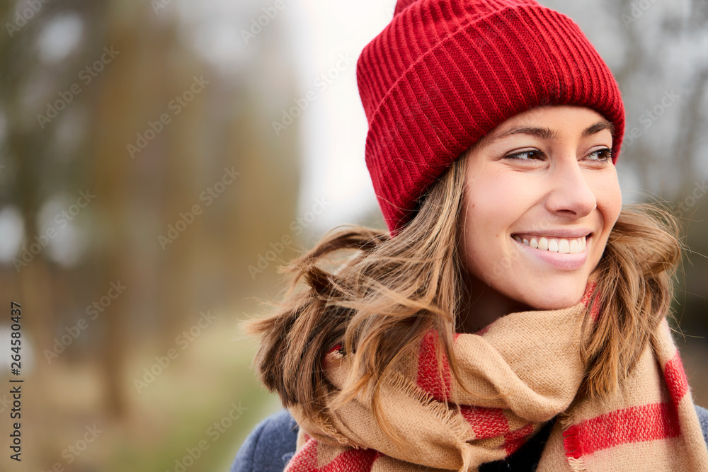 Pretty girl in winter fashion, smiling and looking away Pretty girl in winter fashion, smiling and looking away