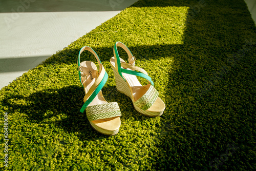 women's summer shoes on green grass