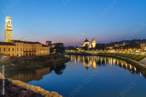 View from Ponte Pietra on Adige River and city at night. Verona. Italy