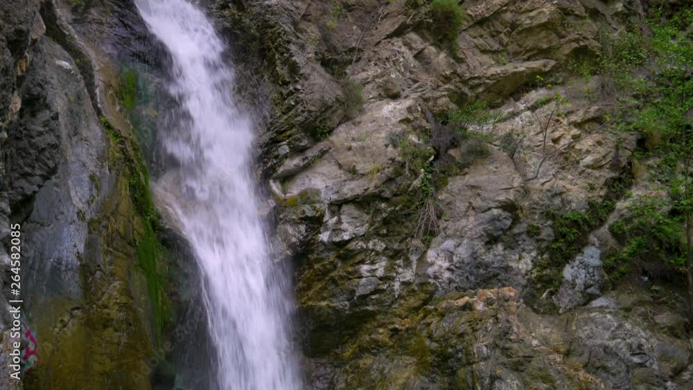 Shot of a tall waterfall in California Shot of a tall waterfall in California