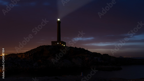 The lighthouse of the Cabo de Palos at the southern tip of the Mar Menor in Spain at night.