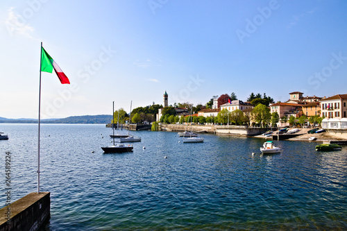 View of Lesa, little village on the coast of Lake Maggiore, Piedmont, Italy, sunny spring morning photo