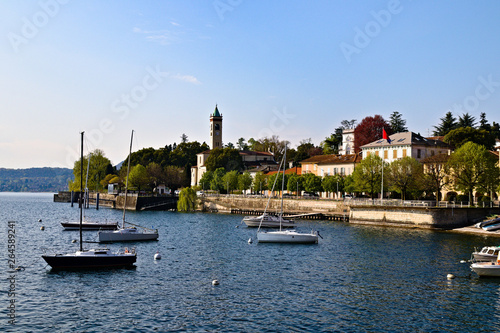 View of Lesa, little village on the coast of Lake Maggiore, Piedmont, Italy, sunny spring morning