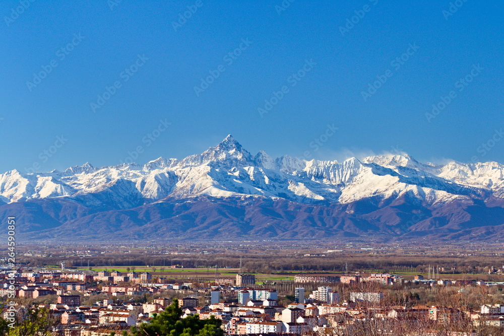 Mount Viso, Alps peak, seen from Turin, Piedmont, during a spring morning with snow and pink light on the glaciers