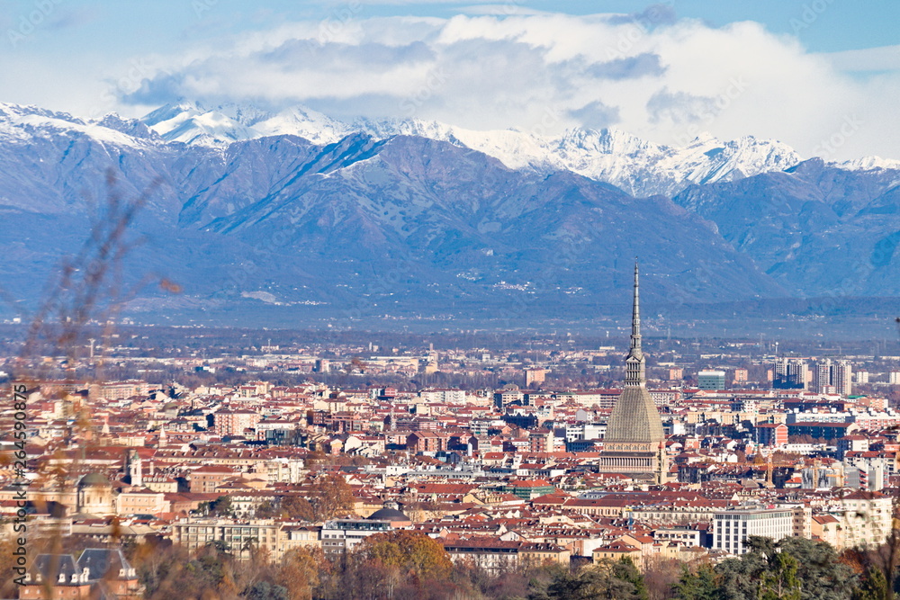 Panorama of Turin, overlooking the city center and the Mole Antonelliana, a backdrop of snow-capped mountains 