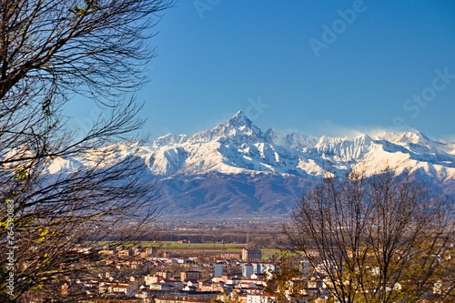 Mount Viso, Alps peak, seen from Turin, Piedmont, during a spring morning with snow and pink light on the glaciers