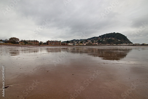 Minehead is a coastal town in Somerset, England, on the south bank of the Bristol Channel and experiences one of the highest tidal ranges in the world. Here the beach is visible during the low tide