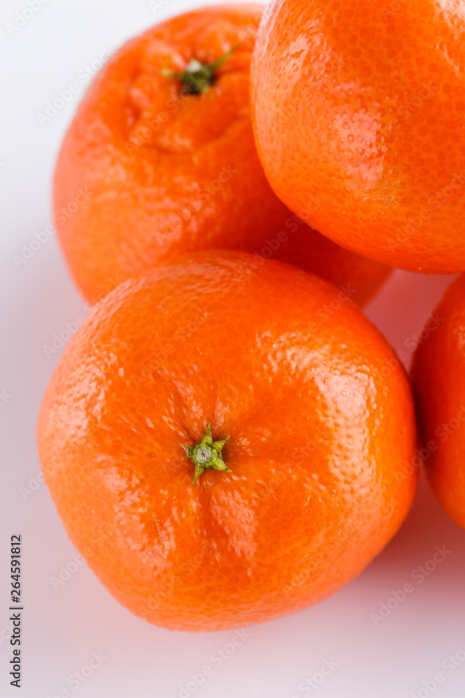 juicy mandarin on a white acrylic background juicy mandarin on a white acrylic background