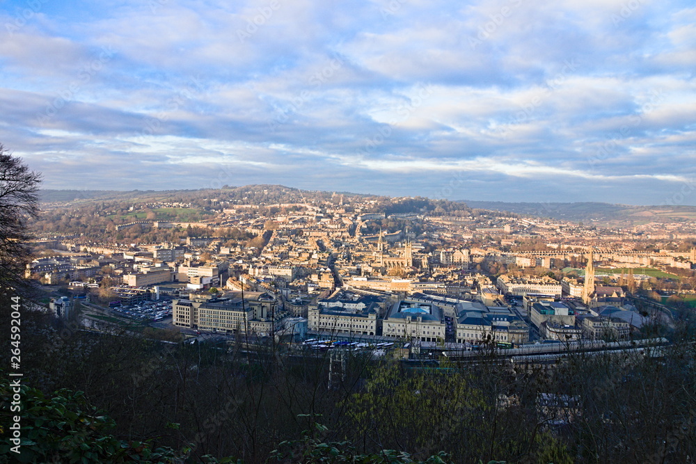 Aerial view on Bath old town at sunset from Alexandra Park, cloudy blue sky. Somerset, England