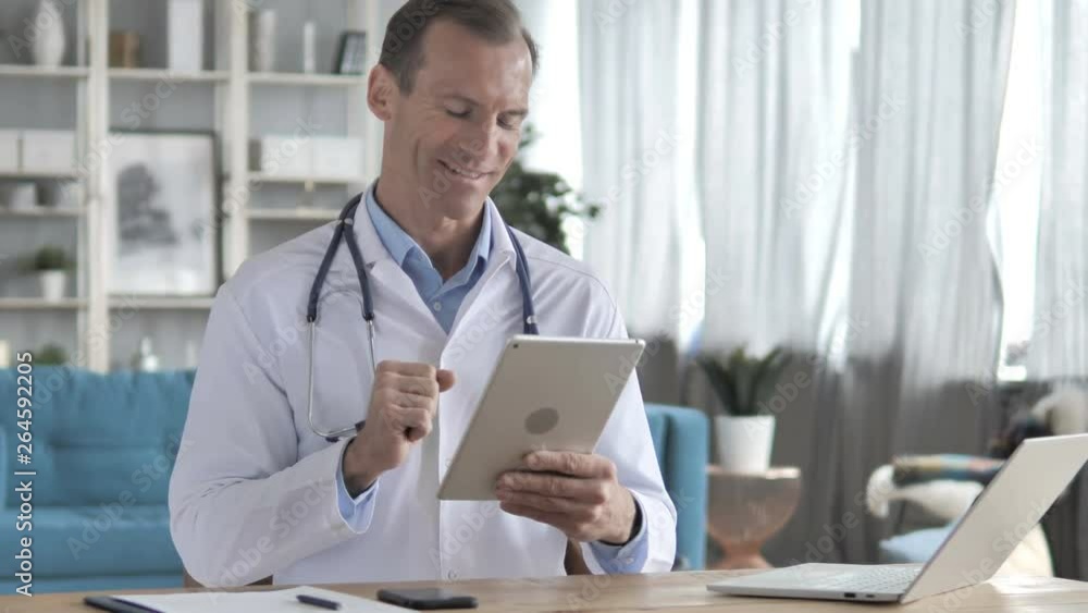 Video Chat via Tablet with Patient by Senior Doctor Video Chat via Tablet with Patient by Senior Doctor