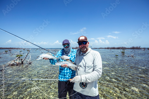 Bonefish double catch in the Caribbean Flats photo