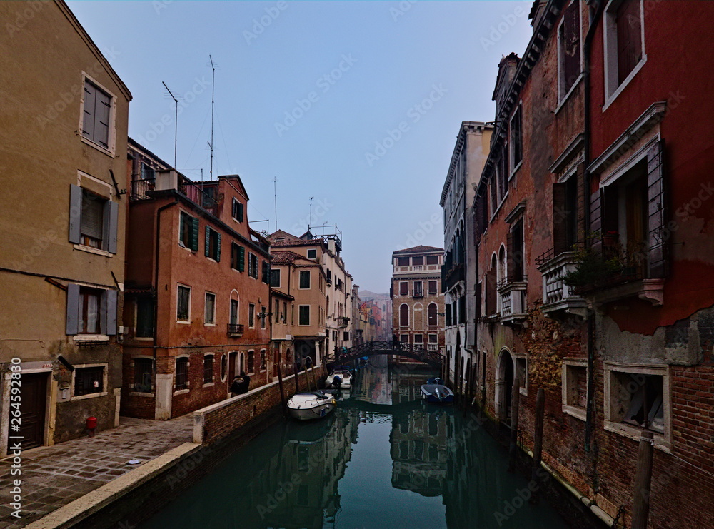 Venice, Italy - December 29, 2018: Typical view in the old town with water channels and bridges