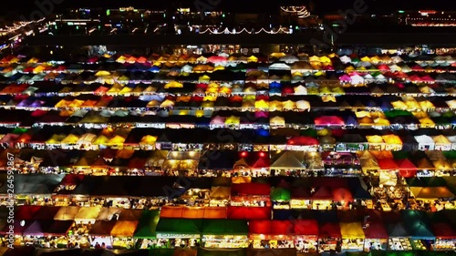 Night market called train night market Ratchada bird eye view, people visit to enjoy many kind of street food, located at back of Esplanade Ratchadapisek Department store, Bangkok, Thailand photo