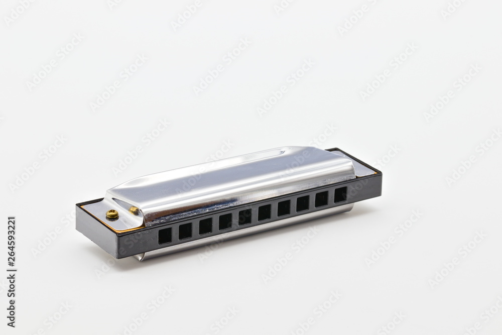 isolated silver shiny harmonica on white limbo background isolated silver shiny harmonica on white limbo background