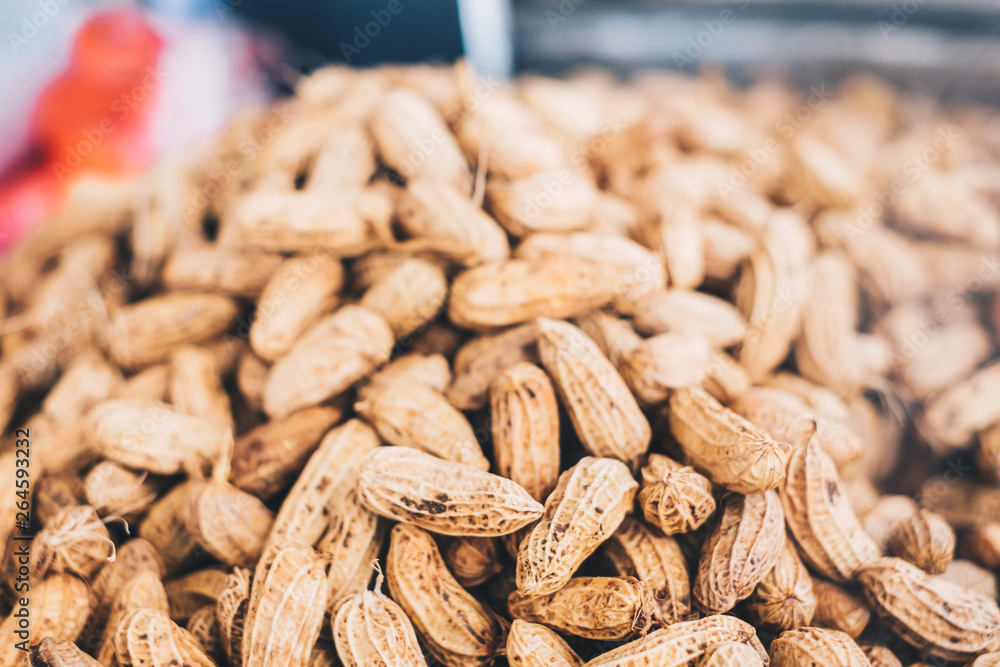 Bunch of cooked peanuts in shells. Selected focus. Copy space. Bunch of cooked peanuts in shells. Selected focus. Copy space.