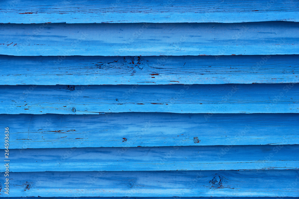 Fototapeta premium Blue painted plank fence with cracked and scratch. Horizontal grunge texture