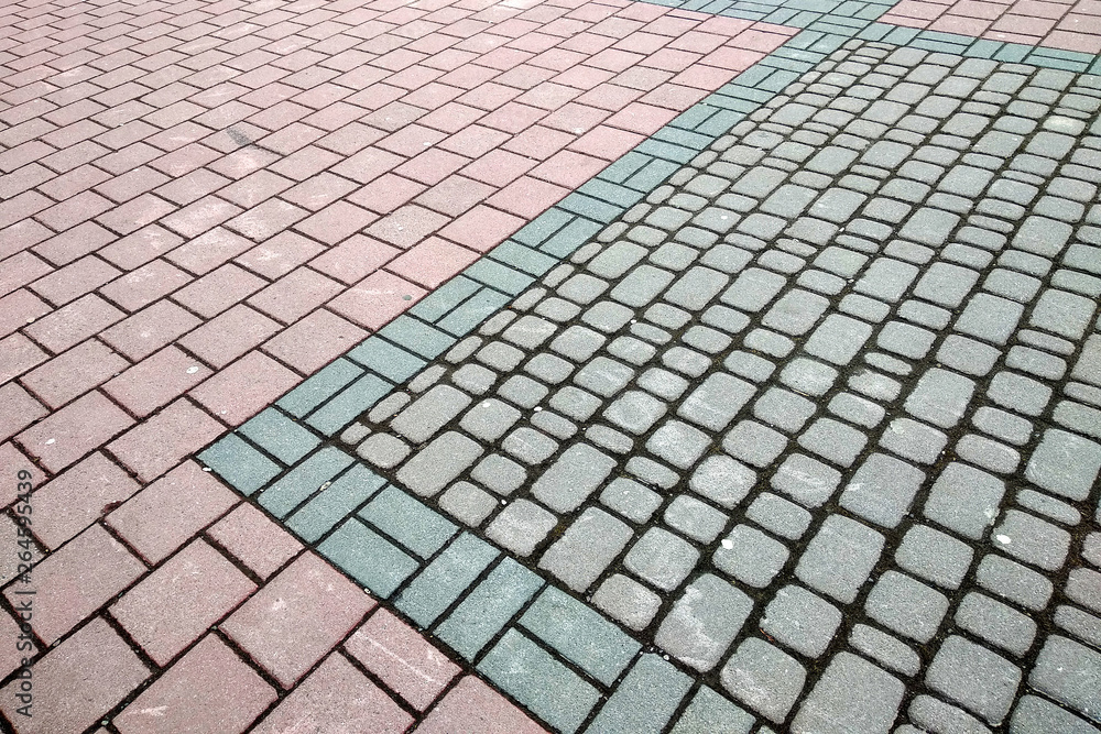 Stone pavement in perspective. Granite cobblestone pavement tiles.