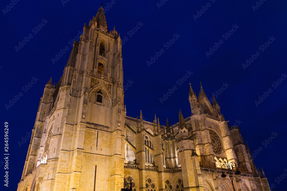 Cathedral of Leon. Gothic monument with blue sky and illumination lit at nightfall