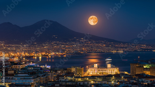 Full moon rises above Mount Vesuvius, Naples and Bay of Naples, Italy photo