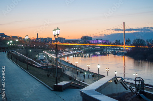 Tyumen, Russia, on April 19, 2019: A spring high water on the embankment in Tyumen in the evening. © strekoza