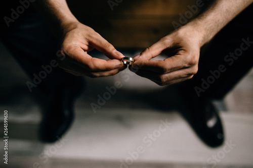 man holds rings