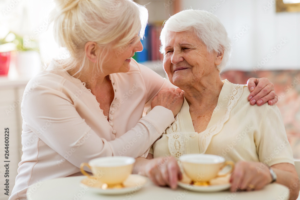 Senior woman spending quality time with her daughter Senior woman spending quality time with her daughter