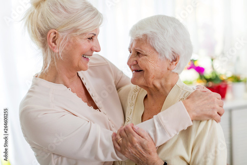 Senior woman spending quality time with her daughter photo