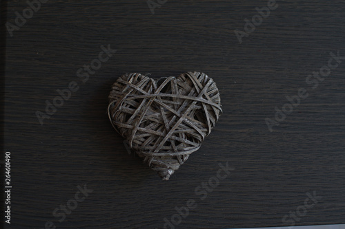 grey wicker heart on wooden background, Love.