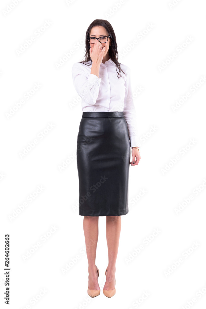 Laughing young business woman adjusting eye glasses with finger. Full body isolated on white background. Laughing young business woman adjusting eye glasses with finger. Full body isolated on white background.