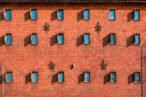 Walls and windows.Old brick wall with many windows.
