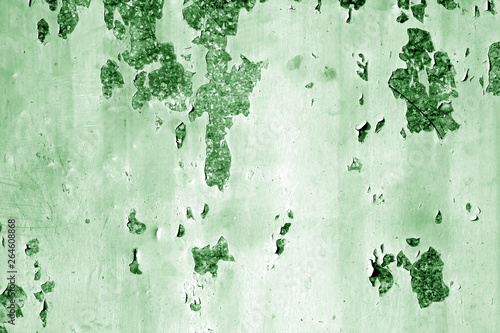 Grungy rusted metal wall surface in green tone.