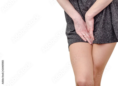 Pelvic thigh young woman with hands holding pressing her crotch of the lower abdomen. Medical or gynecological health problems