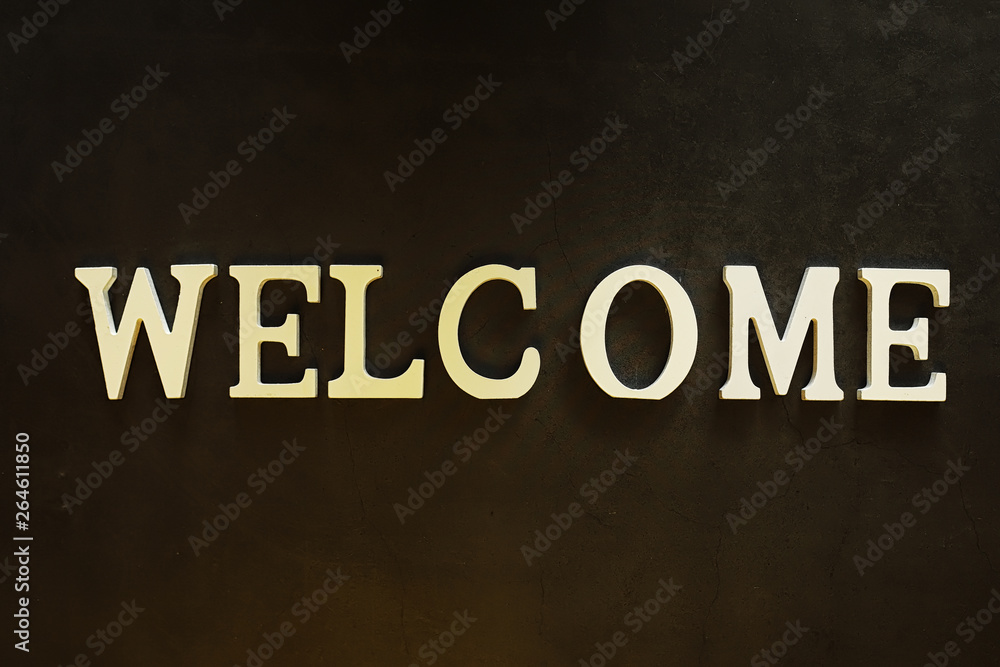 Background concept. Inscription Welcome on a dark background. Background concept. Inscription Welcome on a dark background.