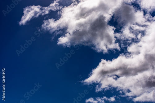 Blue sky with white clouds high contrast  cumulus