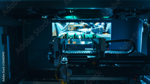 Automated Robotic Industrial Equipment is Testing Electronic Printed Circuit Board and Accept it with Green Light and Laser Technology After Assembly.