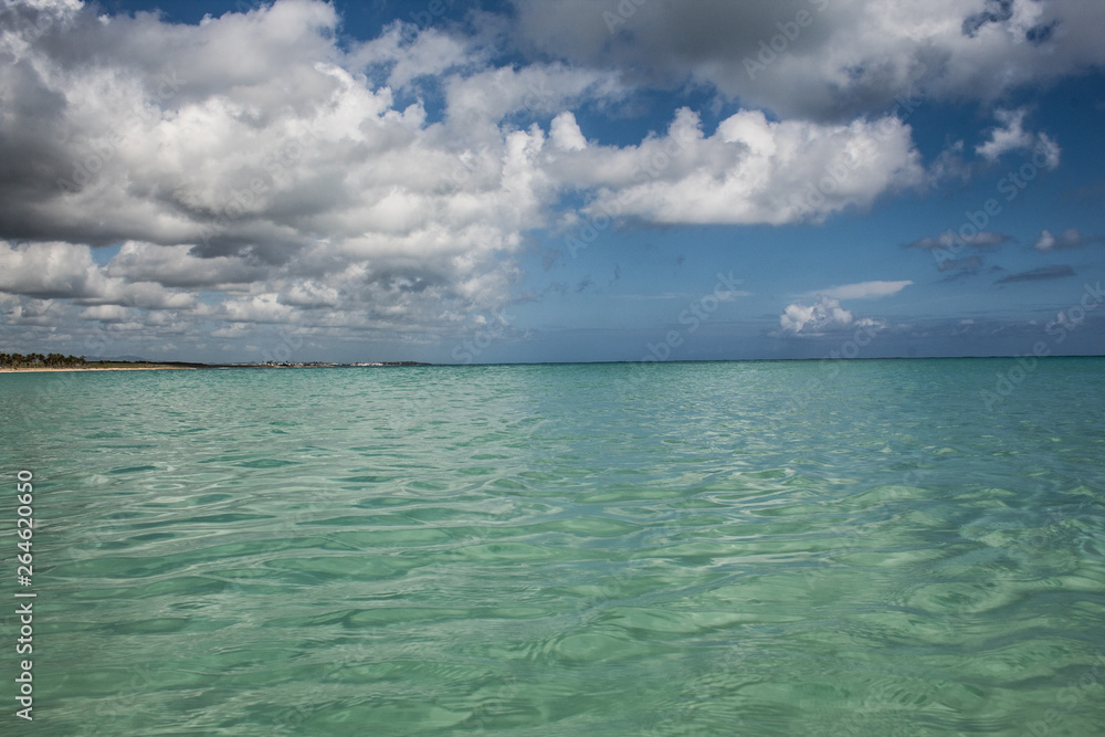 In the middle of an amazing, green and turquoise caribbean sea; transparent water, tropical paradise. Playa Macaro, Punta Cana, Dominican Republic.