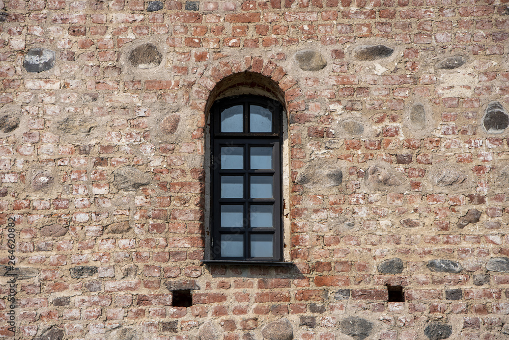 Mir, Belarus, April 24, 2019: The wall with the window, the ancient castle, stone masonry, historic building