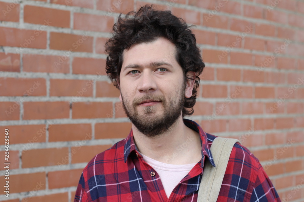 Fototapeta premium 30 years old guy on brick wall