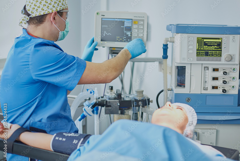 Obraz premium Several doctors surrounding patient on operation table during t