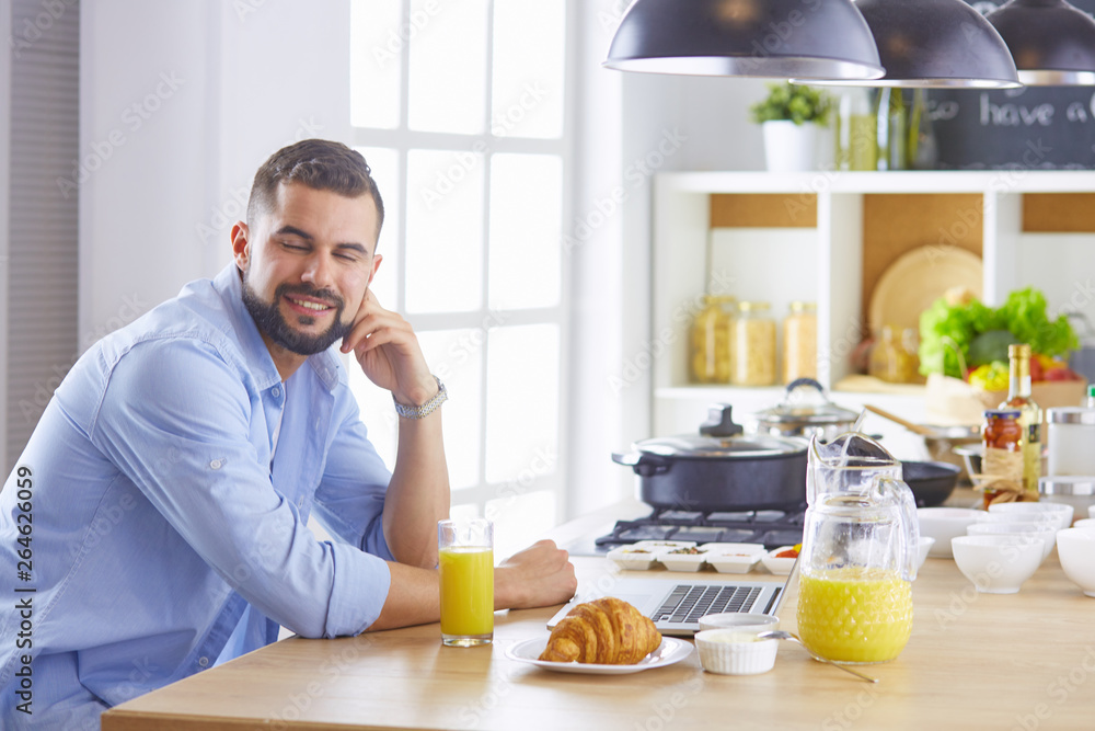 a business man breakfasts with notebook and juice