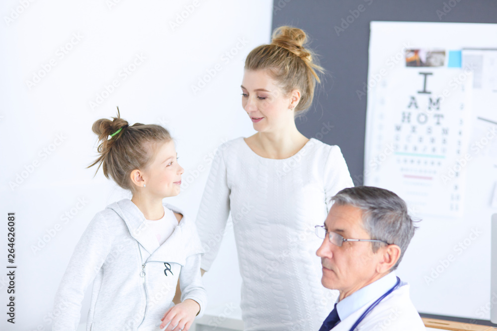 Little girl with her mother at a doctor on consultation Little girl with her mother at a doctor on consultation