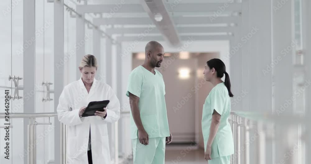 Surgeons walking through a hospital